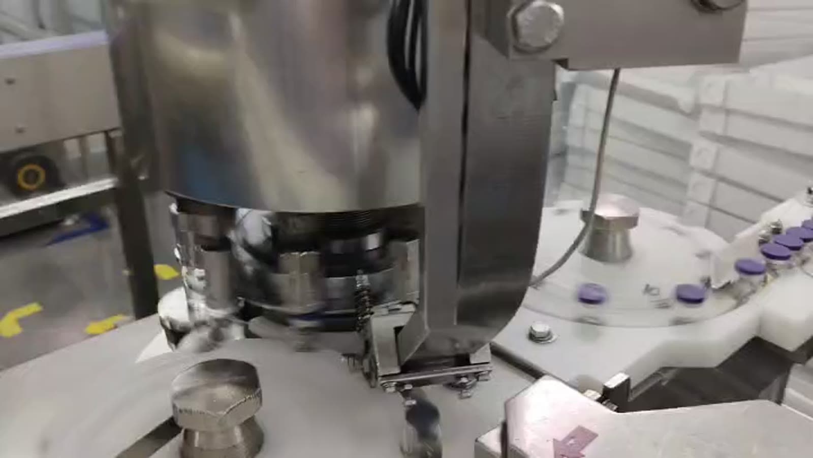 Stainless steel vial-capping machine on PeptideXpo production line